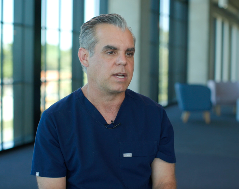 Dr. Michael Garcia looks at the interviewer in a still photo from a video interview