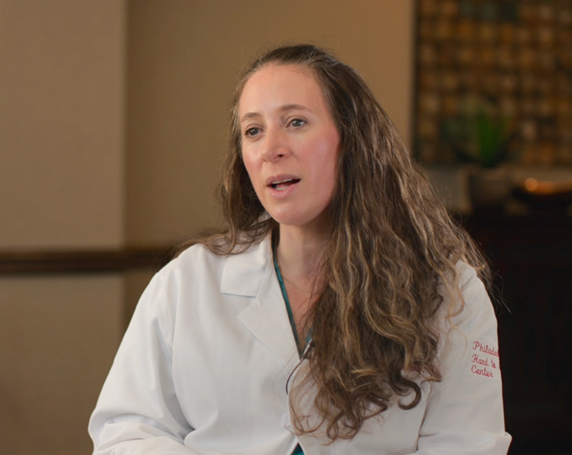 Dr. Meredith Osterman looks at the interviewer in a still photo from a video interview